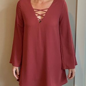 Bell sleeve babydoll dress in rust orange